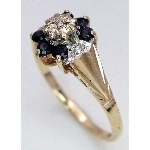204 - A 9K YELLOW GOLD  DIAMOND AND SAPPHIRE RING. 1.9G. SIZE N. SC7075.