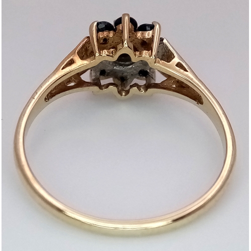 204 - A 9K YELLOW GOLD  DIAMOND AND SAPPHIRE RING. 1.9G. SIZE N. SC7075.