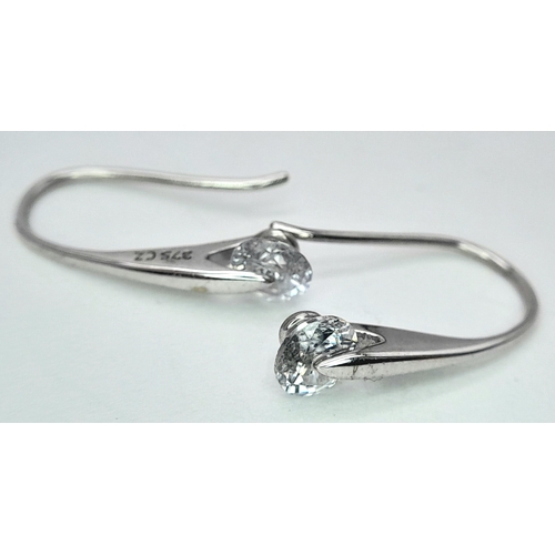 240 - A PAIR OF 9K WHITE GOLD STONE SET DROP EARRINGS. 1.5G. SC7041.