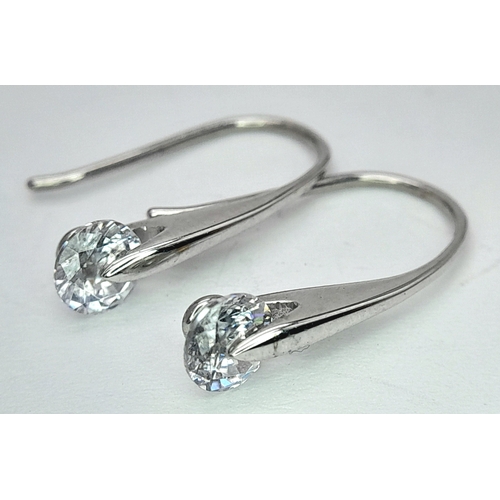 240 - A PAIR OF 9K WHITE GOLD STONE SET DROP EARRINGS. 1.5G. SC7041.