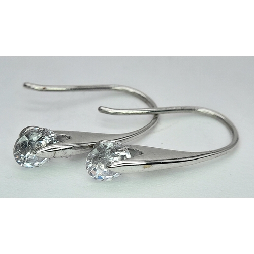 240 - A PAIR OF 9K WHITE GOLD STONE SET DROP EARRINGS. 1.5G. SC7041.