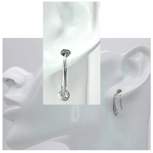 240 - A PAIR OF 9K WHITE GOLD STONE SET DROP EARRINGS. 1.5G. SC7041.