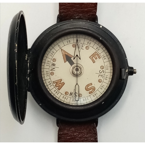 193 - A WW2 SOE-OSS Wrist Compass. The canvas strap has been replaced with a leather one.