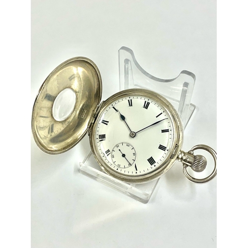 213 - A GENTS SILVER HALF HUNTER POCKET WATCH. IN WORKING ORDER  . REF: LU15/16.