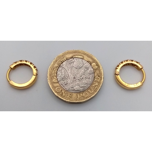 181 - A PAIR OF 18K YELLOW GOLD DIAMOND SET MINI HOOP EARRINGS. 0.30CT. 2.9G. SC7065.
