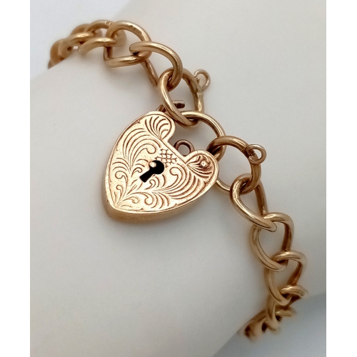 205 - A 9k yellow gold curb bracelet. 13.6g. 16cm total length. SH1911I.