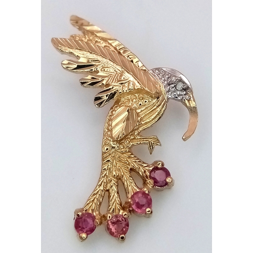 232 - A 9k yellow gold ruby and diamond bird pendant - 0.01ct diamond weight.  0.12ct ruby weight, 1.8g to... 