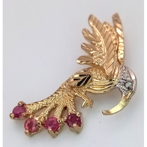 232 - A 9k yellow gold ruby and diamond bird pendant - 0.01ct diamond weight.  0.12ct ruby weight, 1.8g to... 