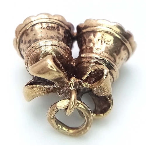218 - A 9k yellow gold bells charm. 4.1g total weight. SH1922I.