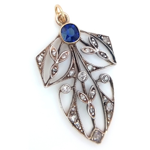 225 - A 9k yellow gold with silver diamond and sapphire pendant. 0.12ct diamond weight. 0.34ct sapphire we... 