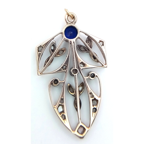 225 - A 9k yellow gold with silver diamond and sapphire pendant. 0.12ct diamond weight. 0.34ct sapphire we... 