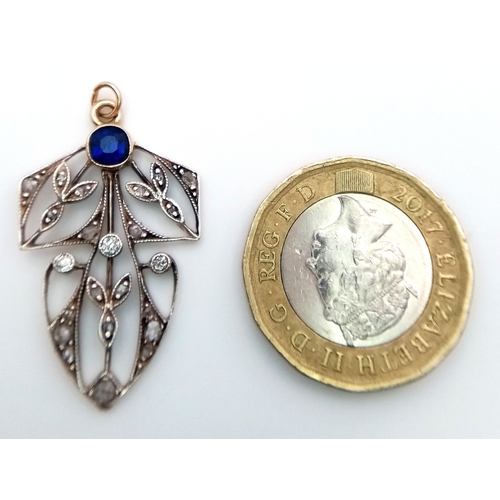 225 - A 9k yellow gold with silver diamond and sapphire pendant. 0.12ct diamond weight. 0.34ct sapphire we... 