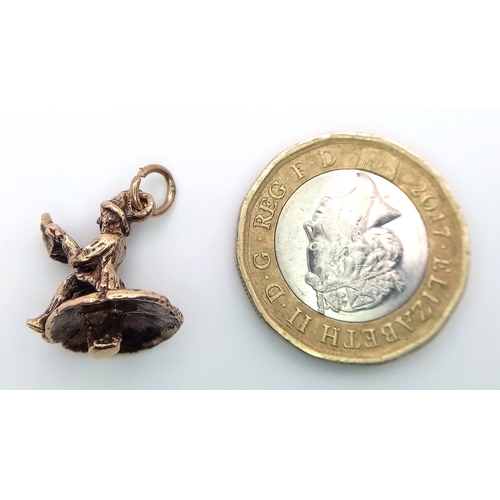 239 - A 9k yellow gold gnome on mushroom charm. 2.7g total weight. SH1921I.