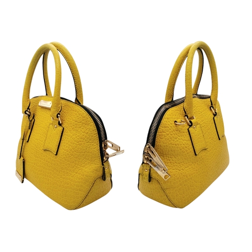 187 - A Burberry Yellow Leather Dome Tote Bag. Yellow leather exterior with gold-toned hardware, dual roll... 