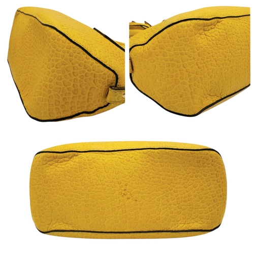 187 - A Burberry Yellow Leather Dome Tote Bag. Yellow leather exterior with gold-toned hardware, dual roll... 