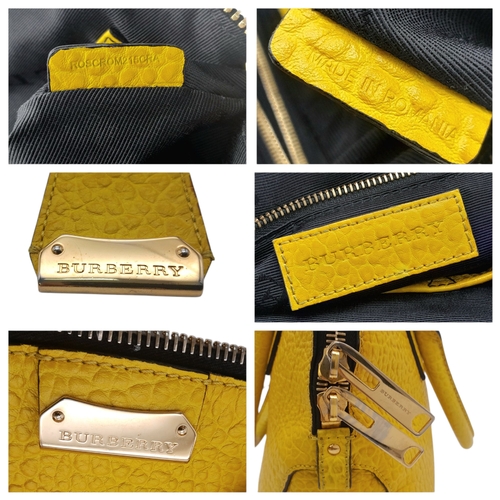 187 - A Burberry Yellow Leather Dome Tote Bag. Yellow leather exterior with gold-toned hardware, dual roll... 