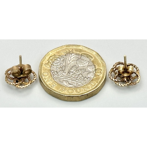 200 - Beautiful 9 CARAT GOLD PAIR OF EARRINGS . ROPE FILIGREE in floral form with Dark Gemstone to Centre.... 