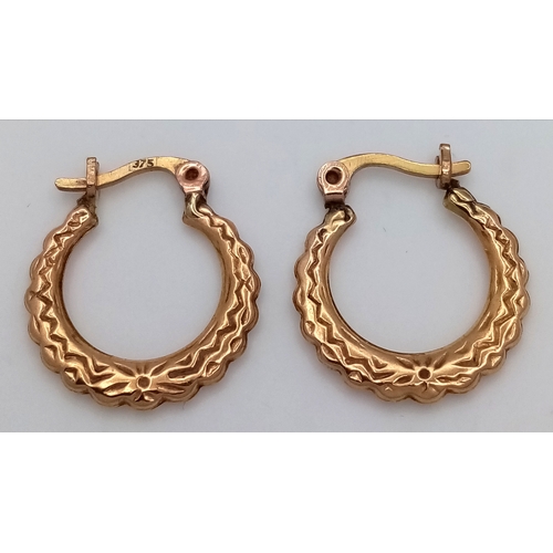 217 - Beautiful pair of 9 CARAT GOLD HOOP EARRINGS. Patterned decoration to both sides. 0.79 grams.