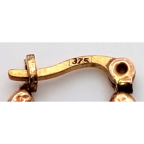 217 - Beautiful pair of 9 CARAT GOLD HOOP EARRINGS. Patterned decoration to both sides. 0.79 grams.