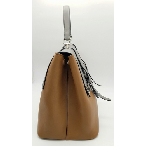 229 - A Prada Milano Two-Tone Leather Tote Bag. Grey and tan smooth leather exterior with silver-toned har... 