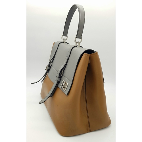 229 - A Prada Milano Two-Tone Leather Tote Bag. Grey and tan smooth leather exterior with silver-toned har... 
