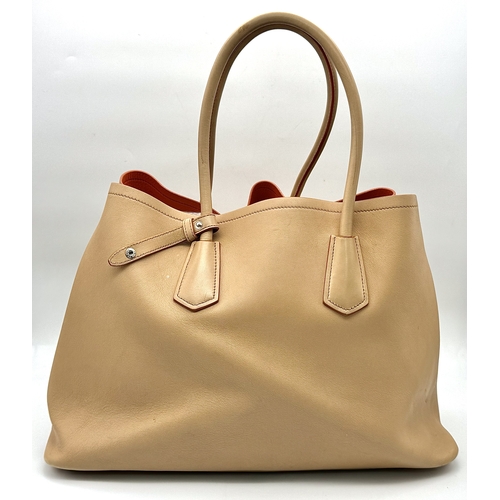 201 - A Prada Beige and Orange Leather Tote Bag. Beige leather exterior with gold-toned hardware, dual rol... 