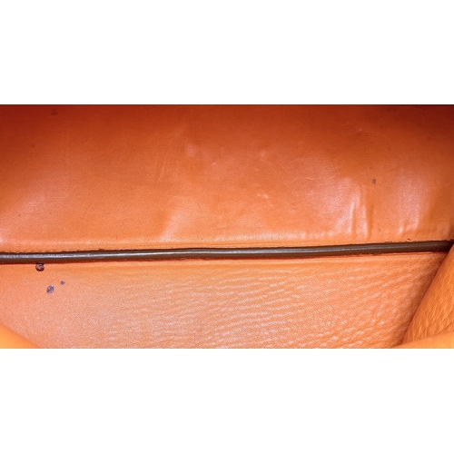 201 - A Prada Beige and Orange Leather Tote Bag. Beige leather exterior with gold-toned hardware, dual rol... 