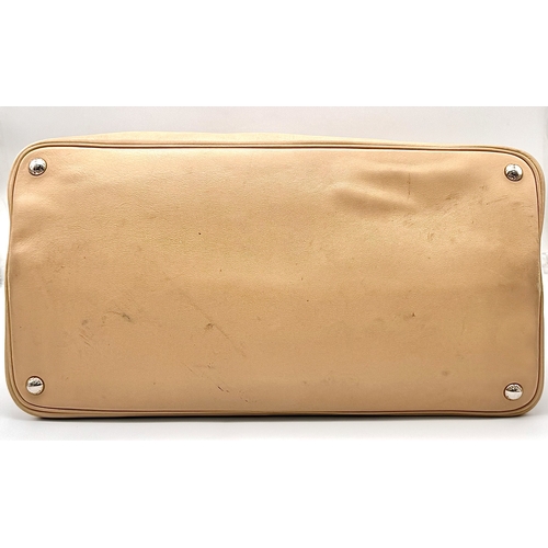 201 - A Prada Beige and Orange Leather Tote Bag. Beige leather exterior with gold-toned hardware, dual rol... 