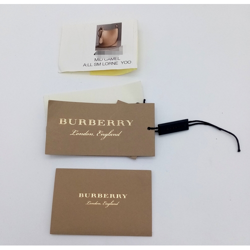 222 - A Burberry Brown Leather Bucket Bag. Brown leather exterior with gold-toned hardware and an adjustab... 