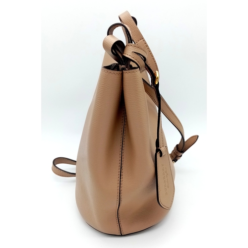 222 - A Burberry Brown Leather Bucket Bag. Brown leather exterior with gold-toned hardware and an adjustab... 