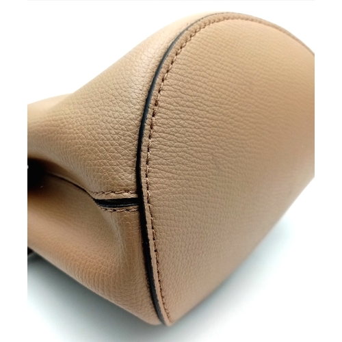 222 - A Burberry Brown Leather Bucket Bag. Brown leather exterior with gold-toned hardware and an adjustab... 