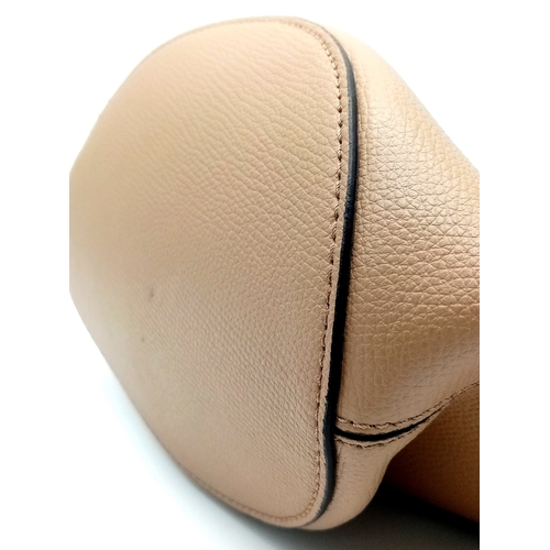 222 - A Burberry Brown Leather Bucket Bag. Brown leather exterior with gold-toned hardware and an adjustab... 