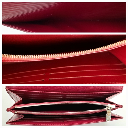 194 - A Louis Vuitton Epi Sarah Wallet. Purple Epi leather exterior with silver-toned hardware and a patch... 