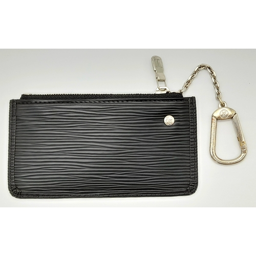 208 - A Louis Vuitton Black Coin Purse. Epi leather exterior with silver-toned hardware, clasp on chain an... 