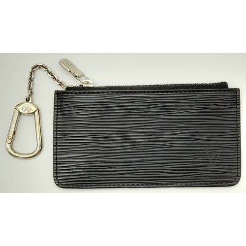 208 - A Louis Vuitton Black Coin Purse. Epi leather exterior with silver-toned hardware, clasp on chain an... 