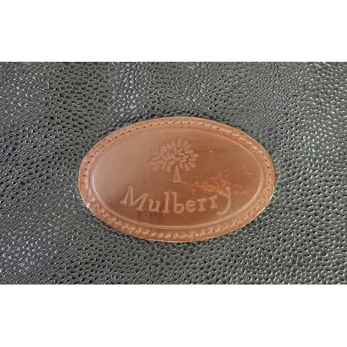 236 - A Mulberry Black Heritage Travel Suitcase. Leather exterior with gold-toned hardware, two zipped com... 