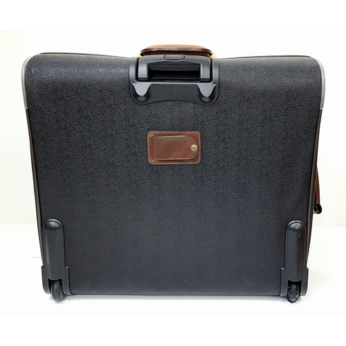 236 - A Mulberry Black Heritage Travel Suitcase. Leather exterior with gold-toned hardware, two zipped com... 