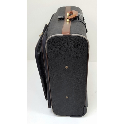 236 - A Mulberry Black Heritage Travel Suitcase. Leather exterior with gold-toned hardware, two zipped com... 