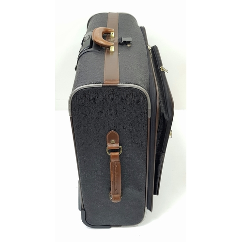 236 - A Mulberry Black Heritage Travel Suitcase. Leather exterior with gold-toned hardware, two zipped com... 