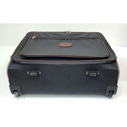 236 - A Mulberry Black Heritage Travel Suitcase. Leather exterior with gold-toned hardware, two zipped com... 