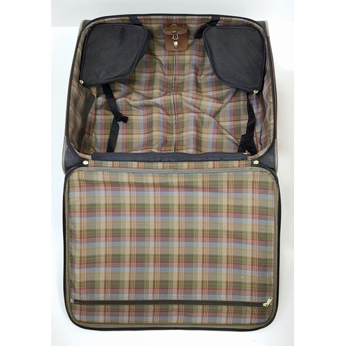 236 - A Mulberry Black Heritage Travel Suitcase. Leather exterior with gold-toned hardware, two zipped com... 