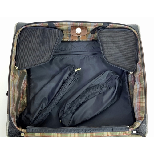 236 - A Mulberry Black Heritage Travel Suitcase. Leather exterior with gold-toned hardware, two zipped com... 