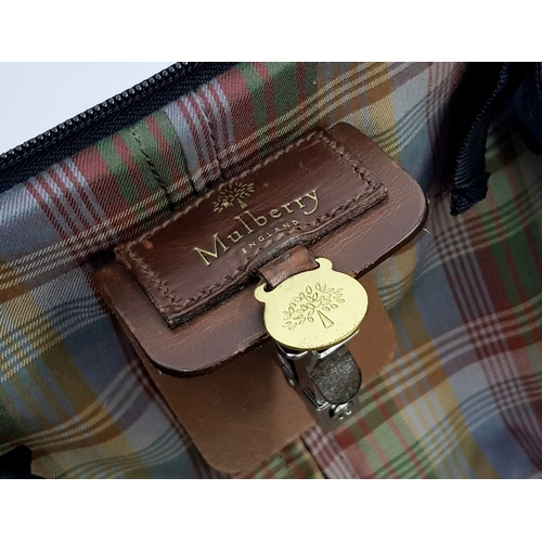 236 - A Mulberry Black Heritage Travel Suitcase. Leather exterior with gold-toned hardware, two zipped com... 
