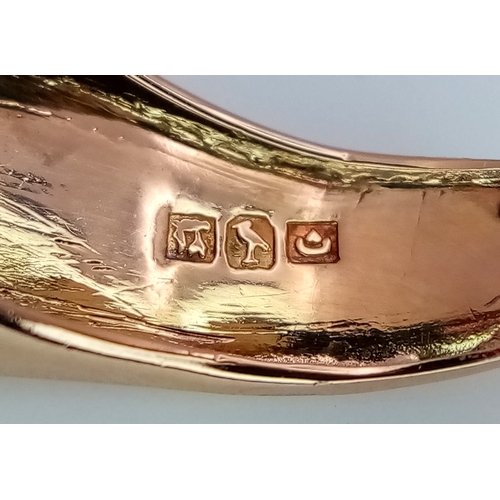 48 - An 18K Gold, Ruby and Diamond Ring. Princess and round cut stones in a mirrored form. 0.40ctw diamon... 