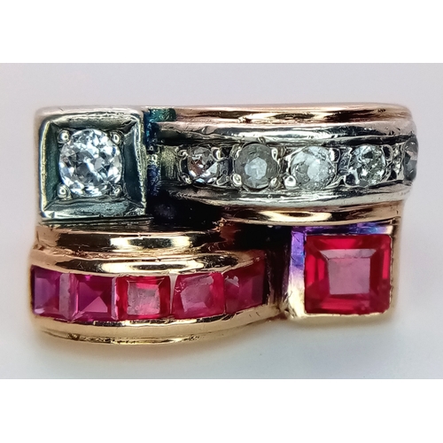48 - An 18K Gold, Ruby and Diamond Ring. Princess and round cut stones in a mirrored form. 0.40ctw diamon... 