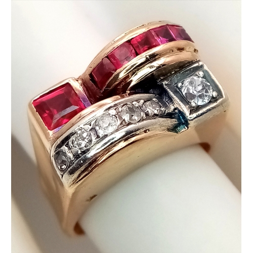 48 - An 18K Gold, Ruby and Diamond Ring. Princess and round cut stones in a mirrored form. 0.40ctw diamon... 
