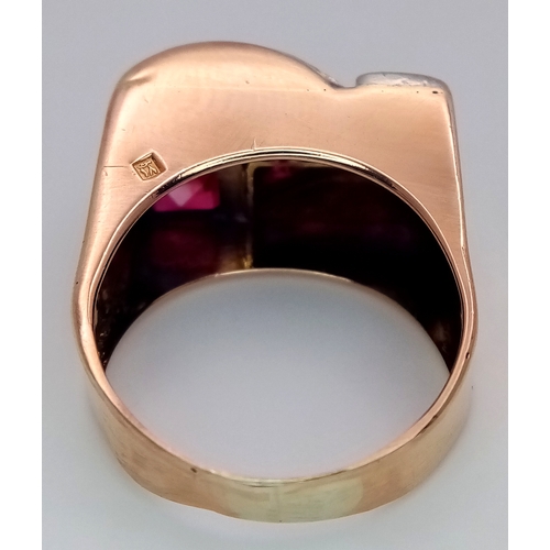 48 - An 18K Gold, Ruby and Diamond Ring. Princess and round cut stones in a mirrored form. 0.40ctw diamon... 