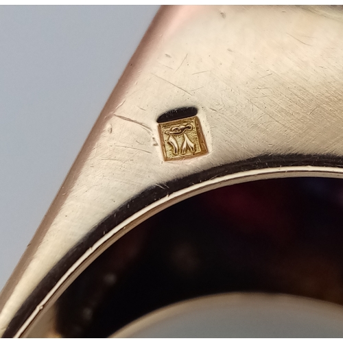 48 - An 18K Gold, Ruby and Diamond Ring. Princess and round cut stones in a mirrored form. 0.40ctw diamon... 