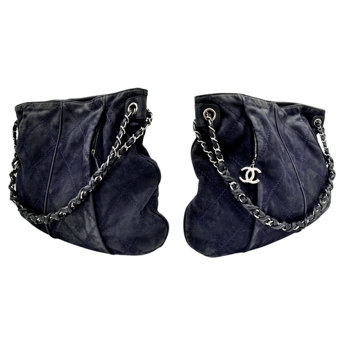54 - A Chanel Dark Blue Tote Bag. Quilted leather exterior with silver-toned hardware, single chain and l... 