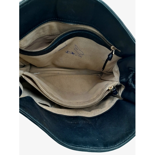 54 - A Chanel Dark Blue Tote Bag. Quilted leather exterior with silver-toned hardware, single chain and l... 